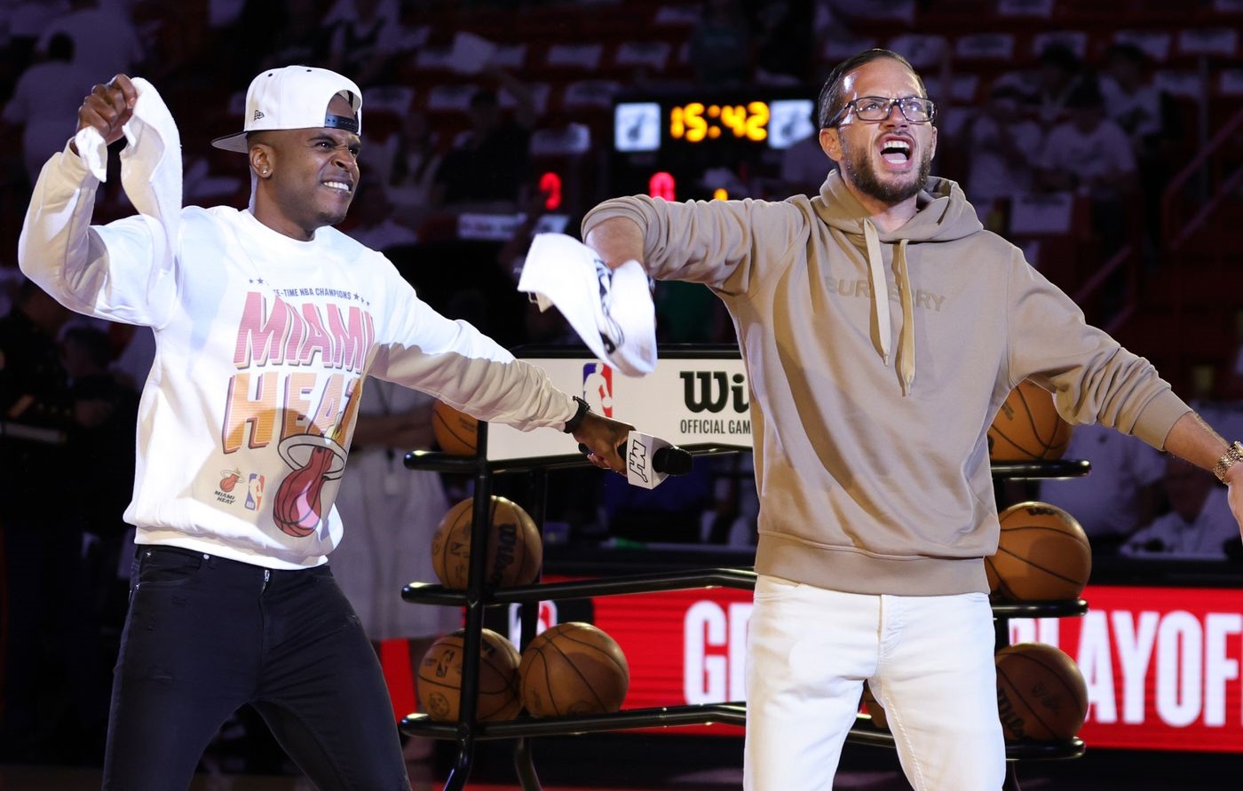 Mike McDaniel celebrates at a Miami Heat game.