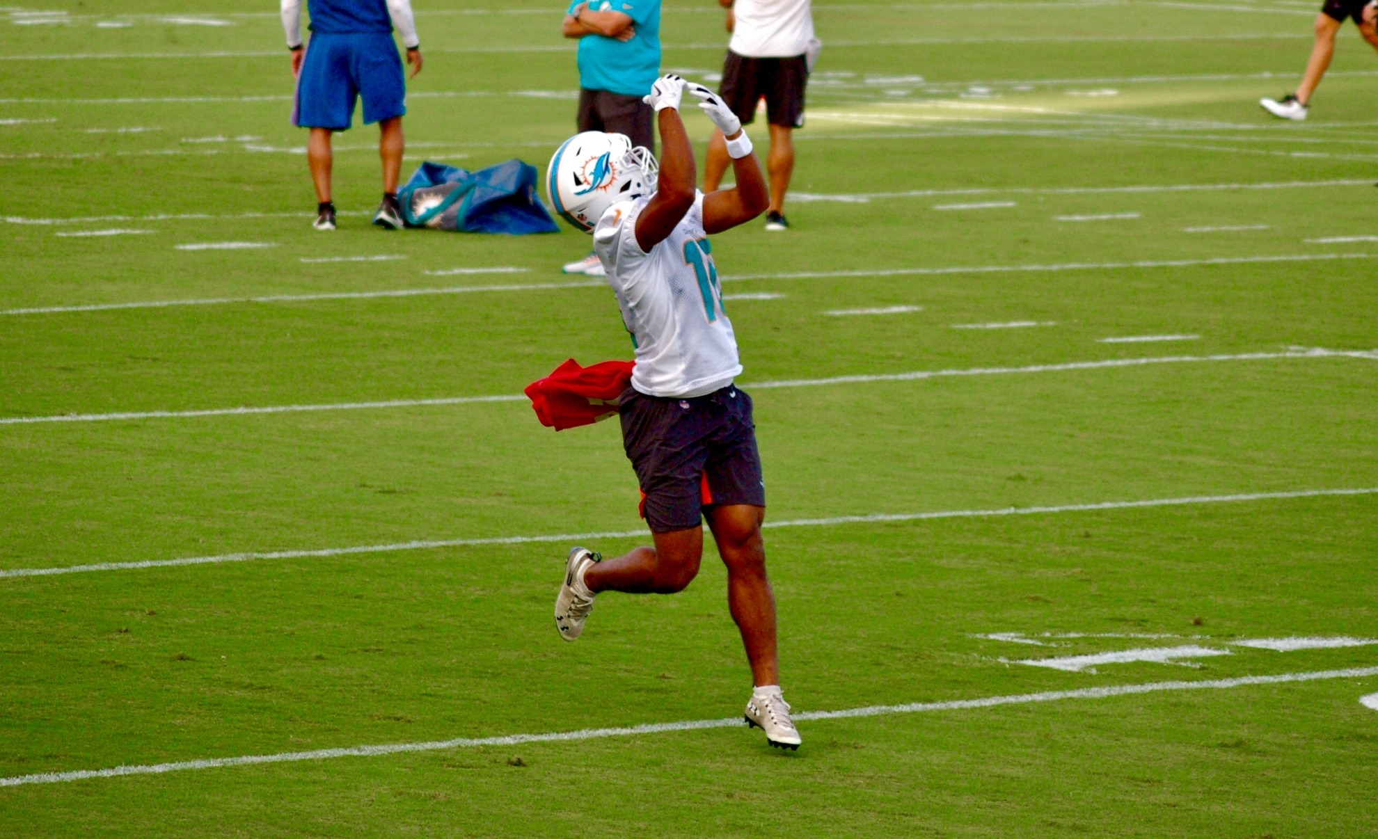 Miami Dolphins quarterback Reid Sinnett (4) watches a video replay