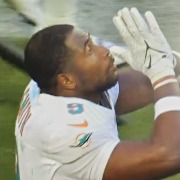 Dolphins tight end Jonnu Smith celebrates with a higher authority after catching the winning touchdown pass in overtime against the Jets.