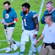 Dolphins quarterback Tua Tagovailoa walks off the field with coach Mike McDaniel and trainers after sustaining a concussion Thursday night against the Buffalo Bills.